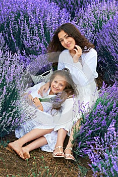Girls are in the lavender flower field, beautiful summer landscape