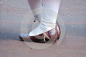 Girls legs in shoes and white tights