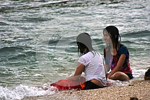 Girls lying on the Sundak beach