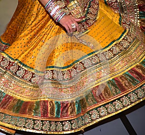 Girls, Man, women are performing garba and dandiya dance wearing traditional Indian folk dress during Navratri festival,Canada