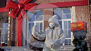 Girls in medical masks dancing RnB dance outdoors at christmastime