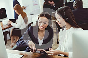 Girls-operators of the call center communicate with each other.