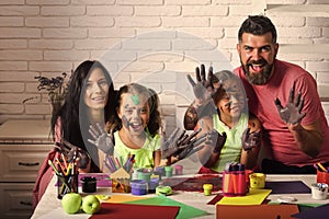 Girls painters painting with mother and father