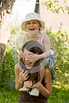 Girls play in the garden