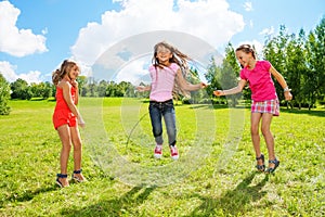 Girls play jumping over the rope