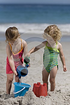 Girls playing on the beach.