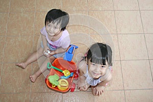 Girls playing beach playset