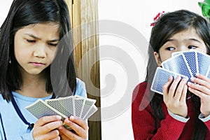 Girls playing cards, one is cheating