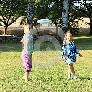 Girls playing frisbee