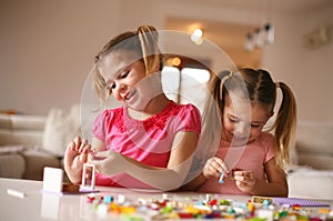 Girls playing at home. Close up image.