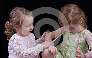 Girls playing with jewelry