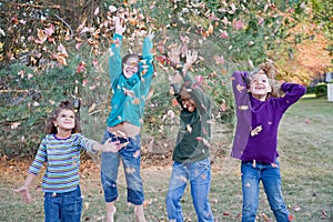 Girls Playing in Leaves