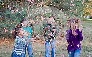 Girls Playing in Leaves