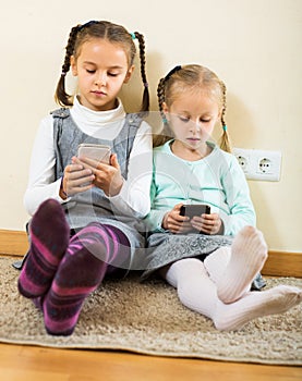 Girls playing online with phones