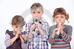 Girls playing the recorder