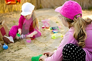 Girls playing in sandbox