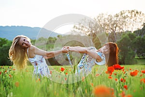 Girls in poppy field