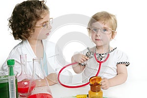 Girls pretending to be doctor in laboratory