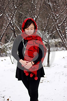 Girls in red and black scarves in the snow