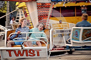 Girls on ride at fun fair