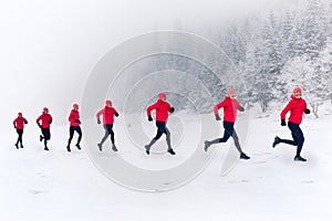 Girls running together on snow in winter mountains. Sport, fitness inspiration and motivation. Happy group of women trail running