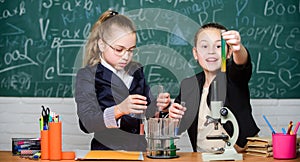 Girls school uniform busy with proving their hypothesis. Private school. School project investigation. School experiment