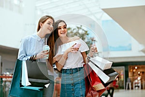 Girls Shopping. Female Friends In Mall