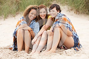 Girls Sitting On Beach Together