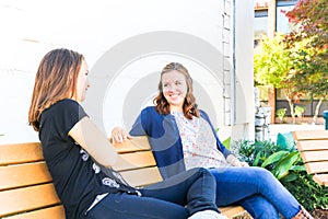 Girls Sitting on Bench together