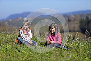 Girls sitting on grass