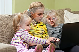 Girls on sofa with laptop