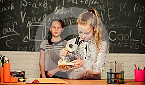 Girls study chemistry in school. Biology and chemistry lessons. Theory and practice. Observe chemical reactions. Formal