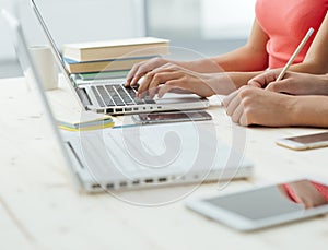 Girls studying at desk and doing homeworks