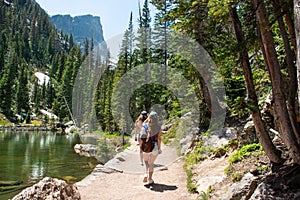 Girls on summer vacation hiking trip in the mountains.