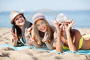 Girls sunbathing on the beach