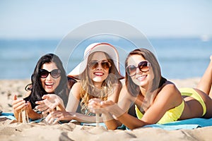 Girls sunbathing on the beach