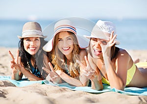 Girls sunbathing on the beach