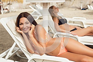 Girls sunbathing on beach