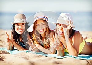 Girls sunbathing on the beach