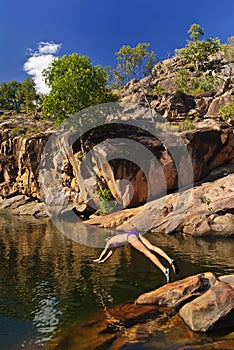 Girls swimming in Billabong, Kakadu National Park photo