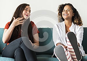 Girls talking together on couch