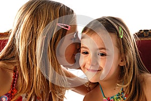 Girls telling secrets