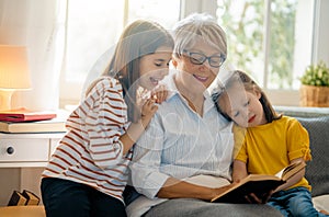 Girls and their grandmother enjoying sunny morning