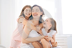 Girls and their mother enjoy sunny morning