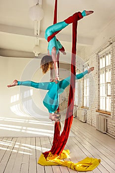 Girls training on aerial silks