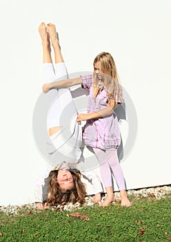 Girls training handstand