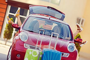 Girls - travelers relaxing in the car