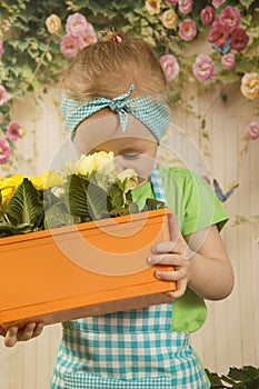 Girls twins of three years care for flowers,