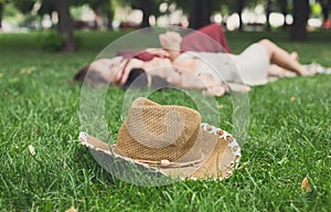 Girls unfocused relax in summer park, young hippie friends leisure