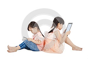 Girls using touch pad and tablet PC